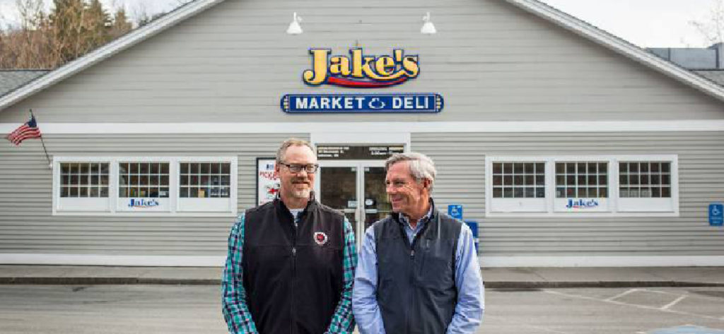 Bruce stands outside Jake's Market & Deli, a gas station convenience store chain in NH and VT, known for good food since 1997